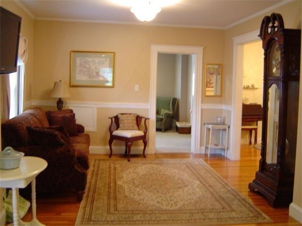 46 Harris Road Newton, MA 02465 - Photo 9 of 28 a living room with furniture and a table