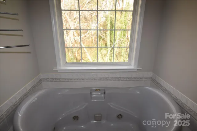 a close up of a bathtub in a bathroom