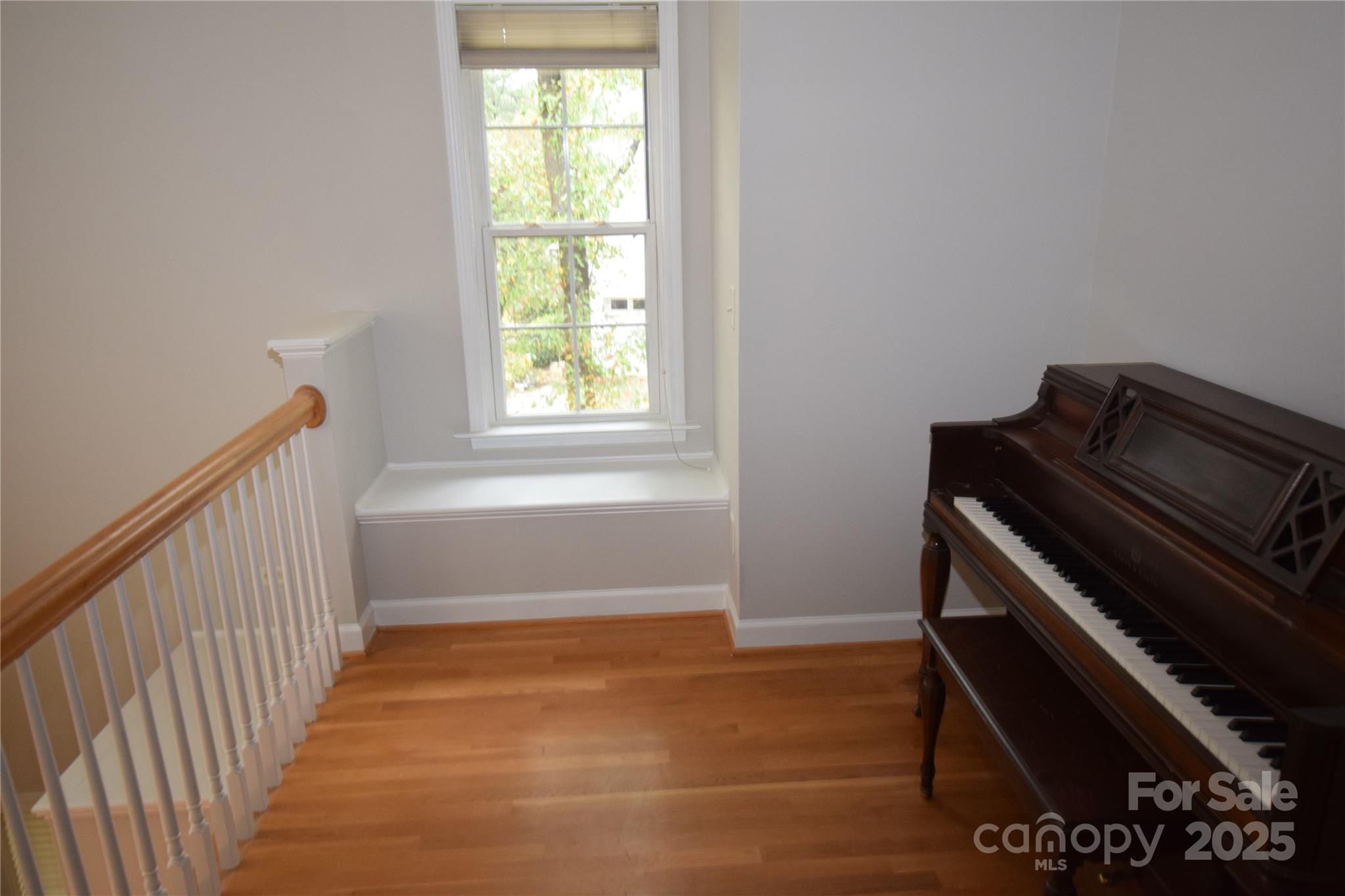 809 Pine Forest Road Charlotte, NC 28214 - Photo 24 of 36 a view of an empty room with wooden floor and a window