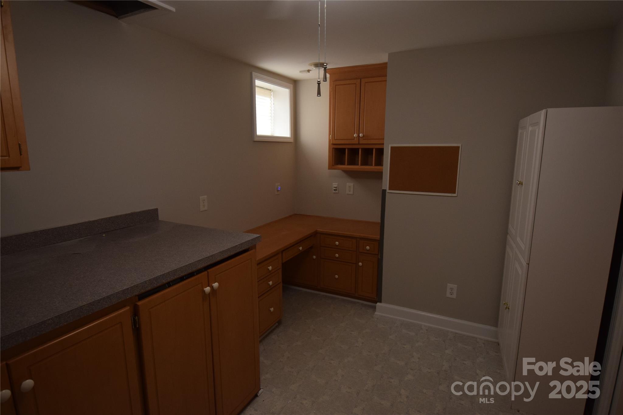 809 Pine Forest Road Charlotte, NC 28214 - Photo 25 of 36 a kitchen with a refrigerator and window