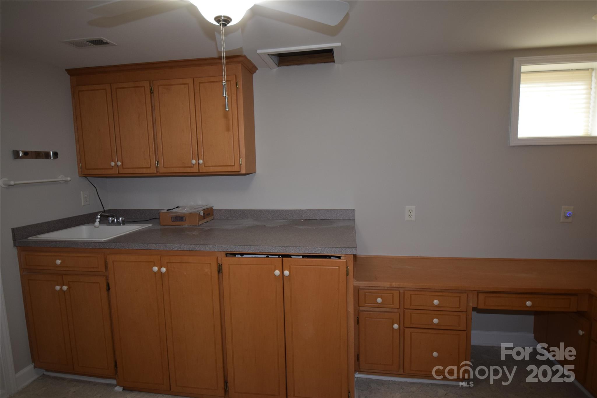 809 Pine Forest Road Charlotte, NC 28214 - Photo 26 of 36 a utility room with cabinets