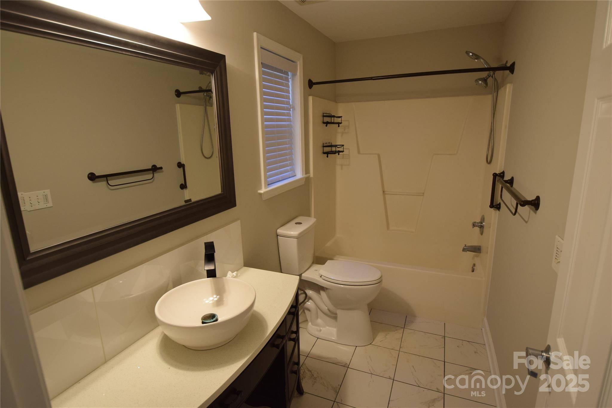 809 Pine Forest Road Charlotte, NC 28214 - Photo 29 of 36 a bathroom with a sink a toilet and shower