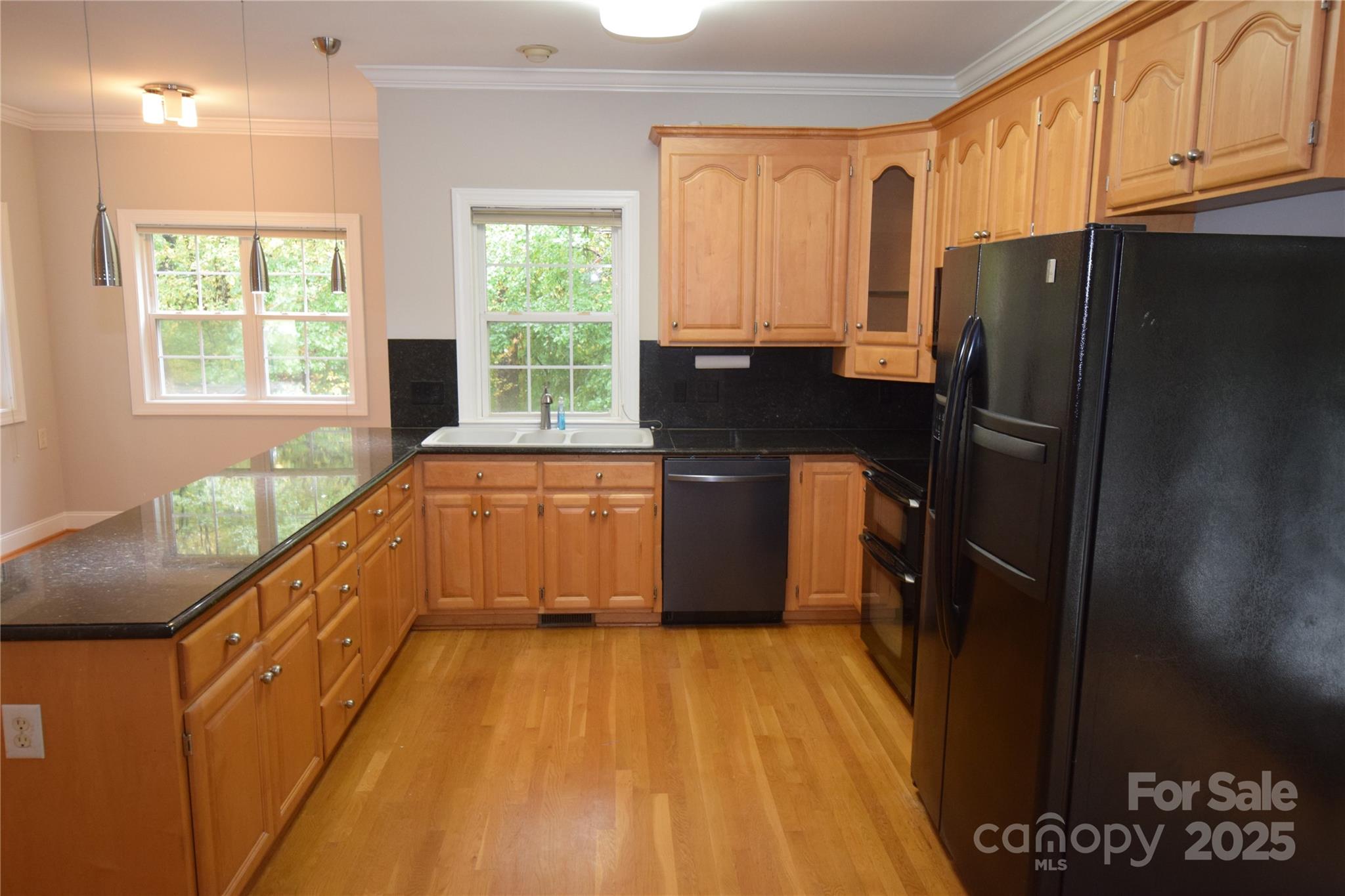 809 Pine Forest Road Charlotte, NC 28214 - Photo 8 of 36 a kitchen with a sink a refrigerator and window