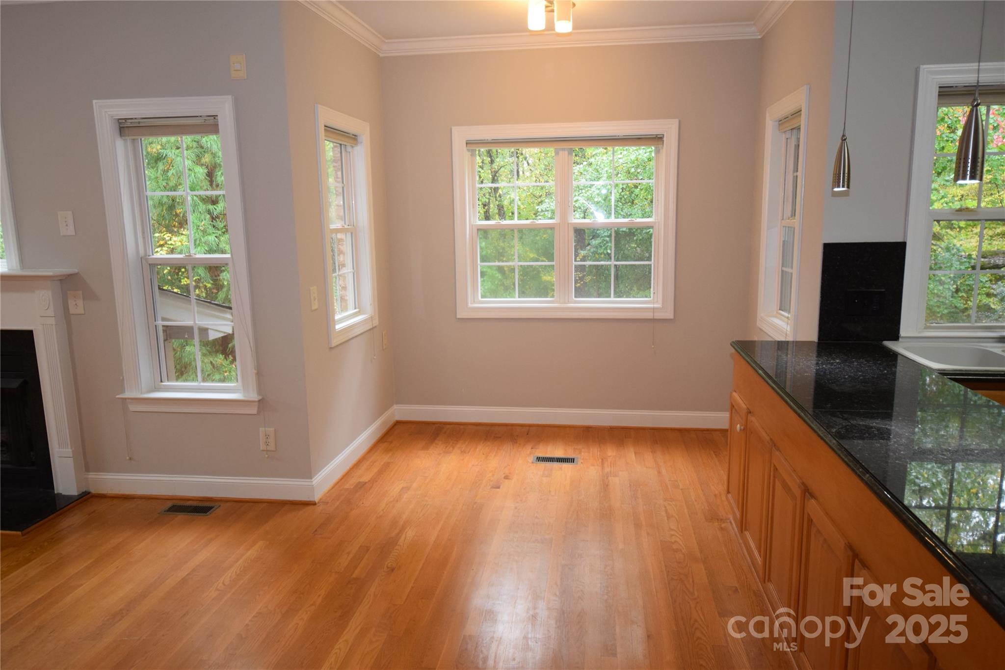 809 Pine Forest Road Charlotte, NC 28214 - Photo 10 of 36 a view of a room with wooden floor and a window