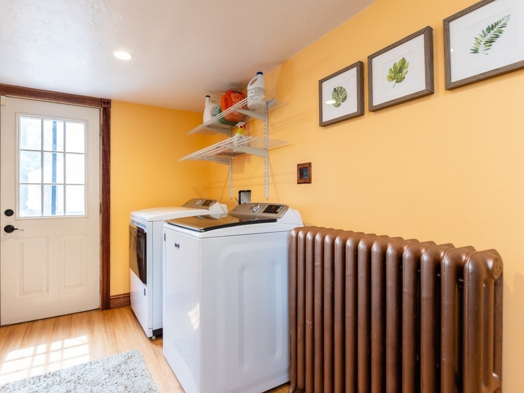 16 Alexander Street Framingham, MA 01702 - Photo 18 of 41 a utility room with wooden floor washer and dryer