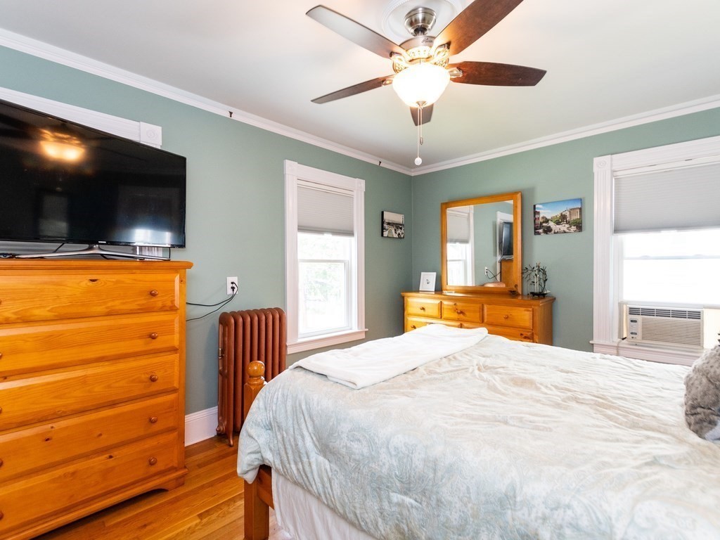 16 Alexander Street Framingham, MA 01702 - Photo 22 of 41 a bedroom with a bed and a flat screen tv