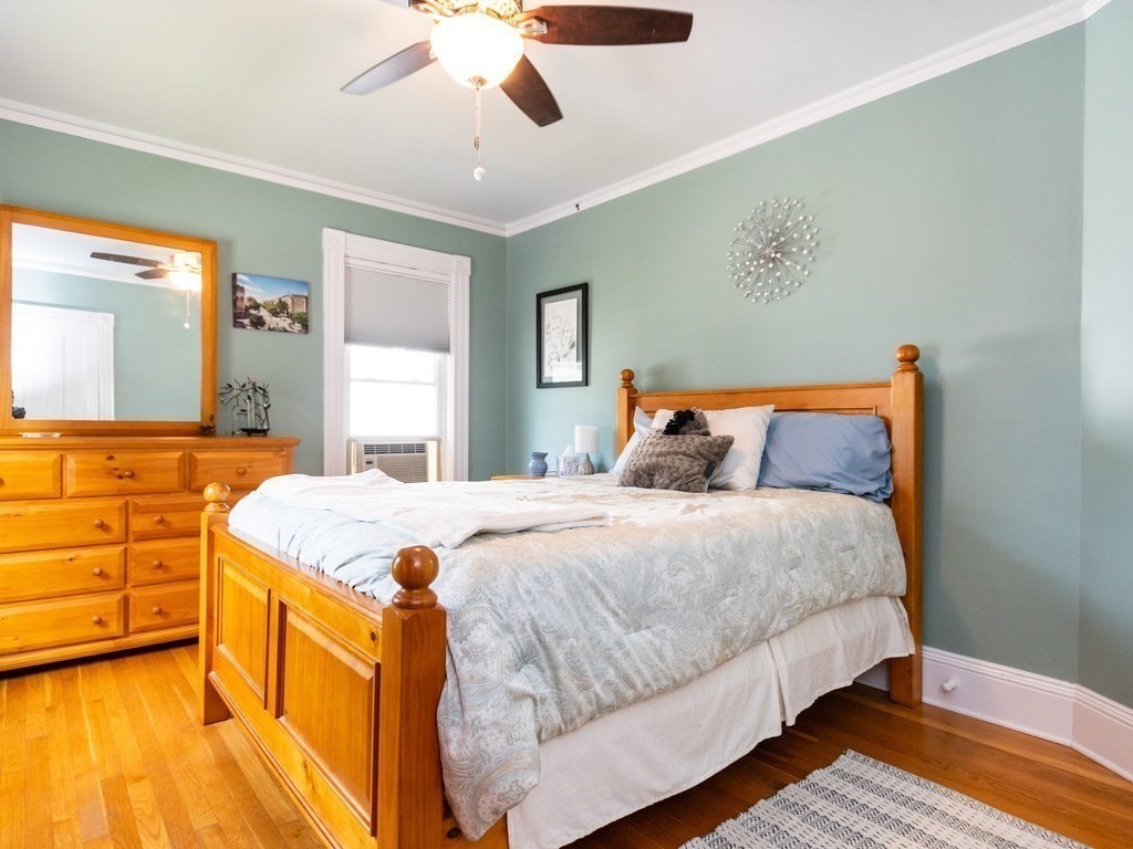 16 Alexander Street Framingham, MA 01702 - Photo 23 of 41 a bedroom with a bed and dresser with mirror