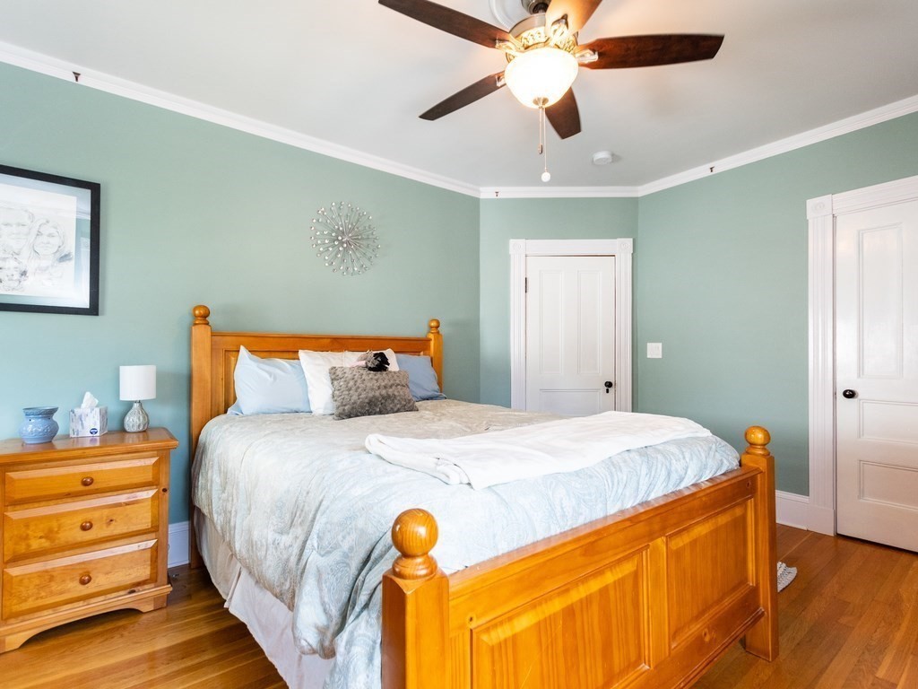 16 Alexander Street Framingham, MA 01702 - Photo 24 of 41 a bedroom with a bed and a chandelier