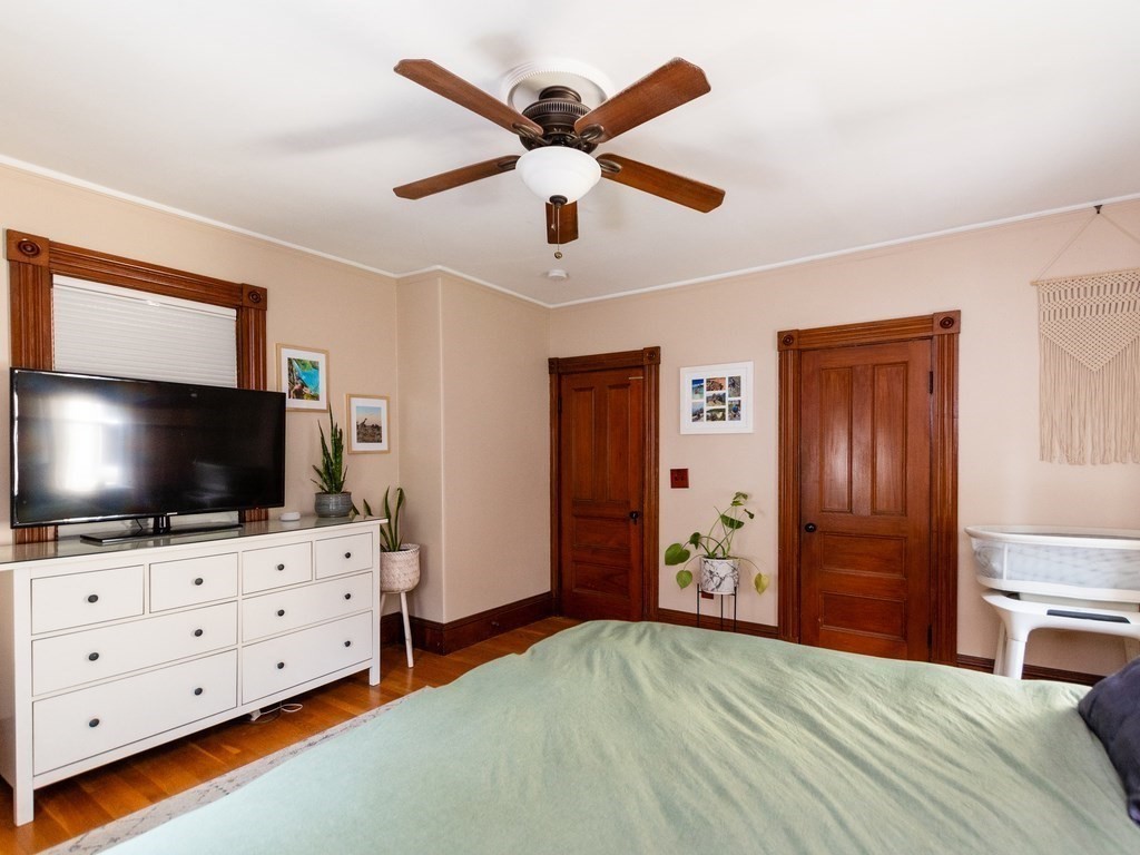 16 Alexander Street Framingham, MA 01702 - Photo 27 of 41 a bedroom with furniture and flat screen tv