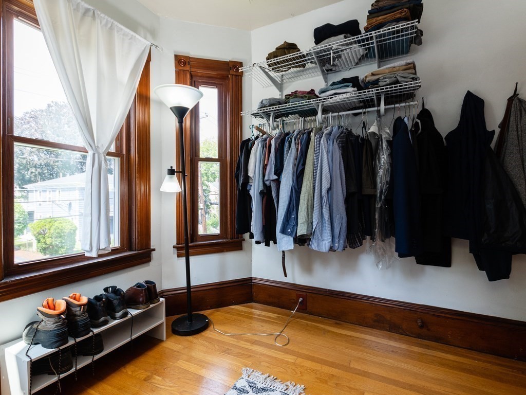 16 Alexander Street Framingham, MA 01702 - Photo 30 of 41 a walk in closet with wooden floor