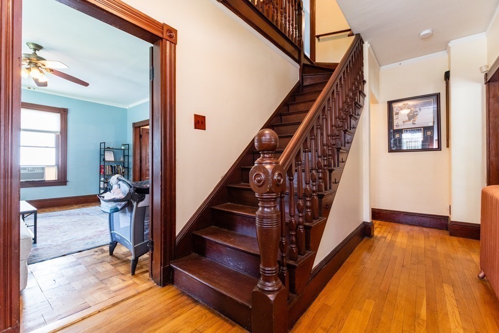 16 Alexander Street Framingham, MA 01702 - Photo 5 of 41 a view of an entryway with wooden floor and stairs