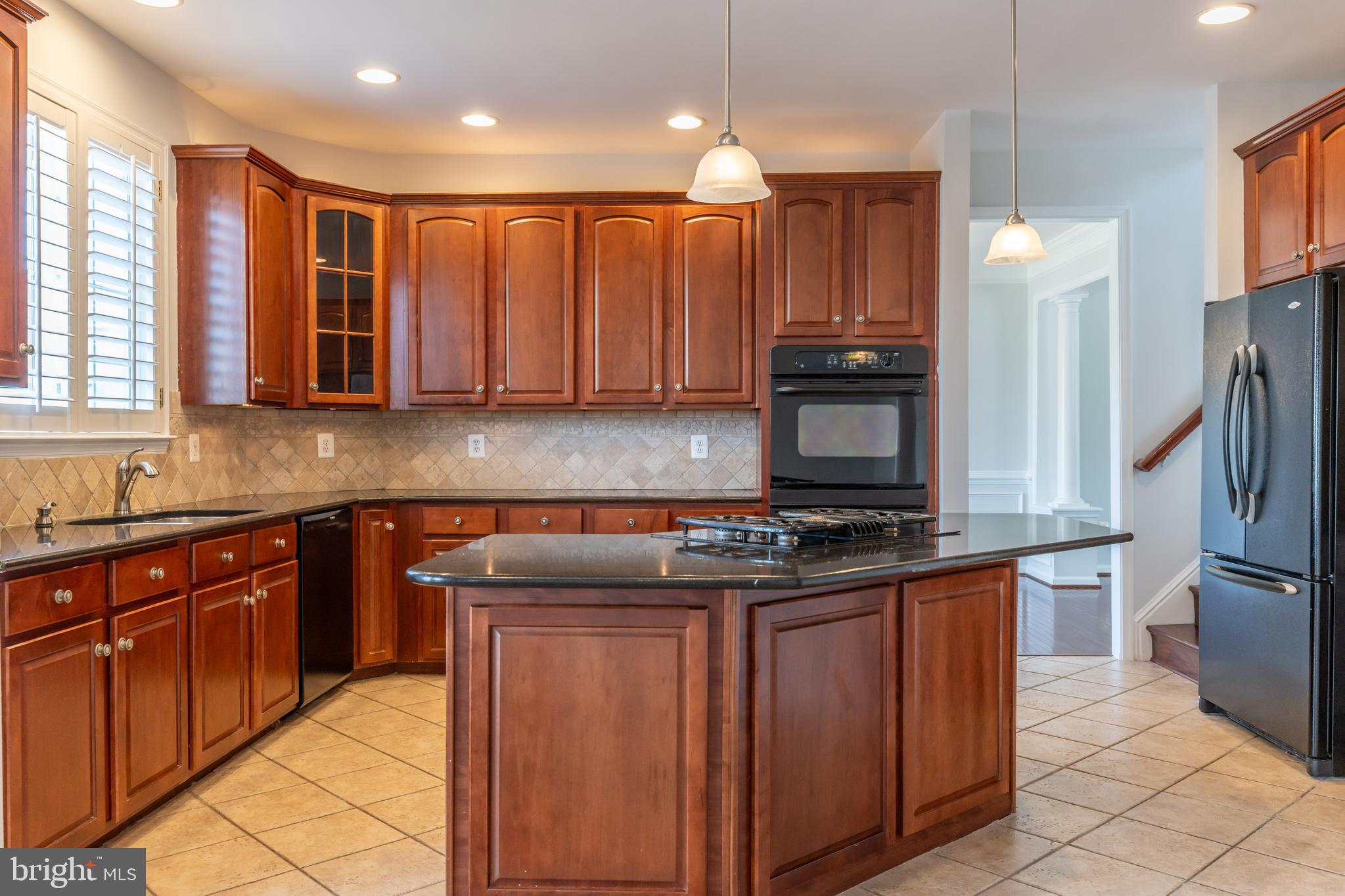 12675 Rushing Creek Court Bristow, VA 20136 - Photo 15 of 49 a kitchen with stainless steel appliances granite countertop a stove top oven a sink and dishwasher