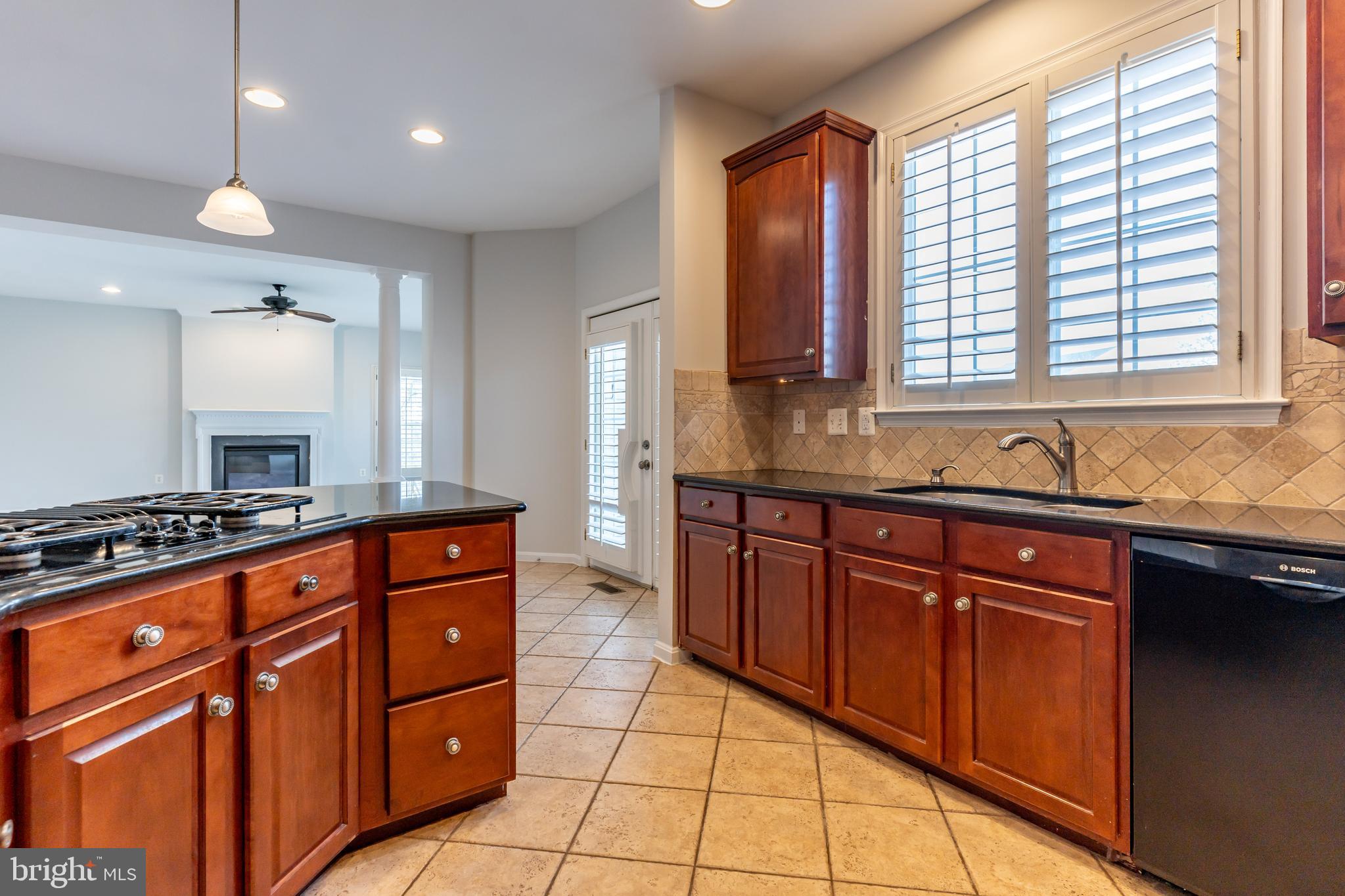 12675 Rushing Creek Court Bristow, VA 20136 - Photo 16 of 49 a kitchen with stainless steel appliances granite countertop a sink stove and cabinets