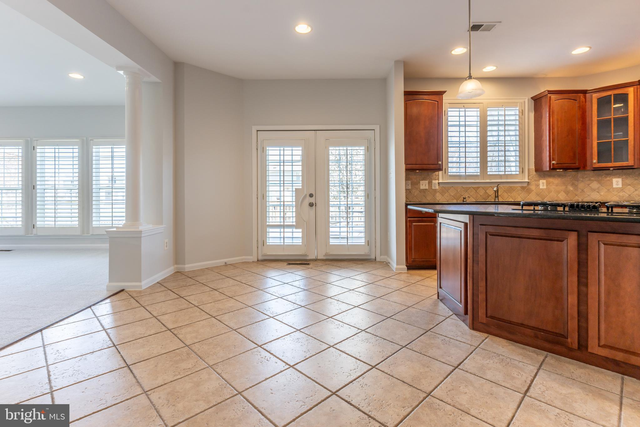 12675 Rushing Creek Court Bristow, VA 20136 - Photo 19 of 49 a large kitchen with a sink and cabinets