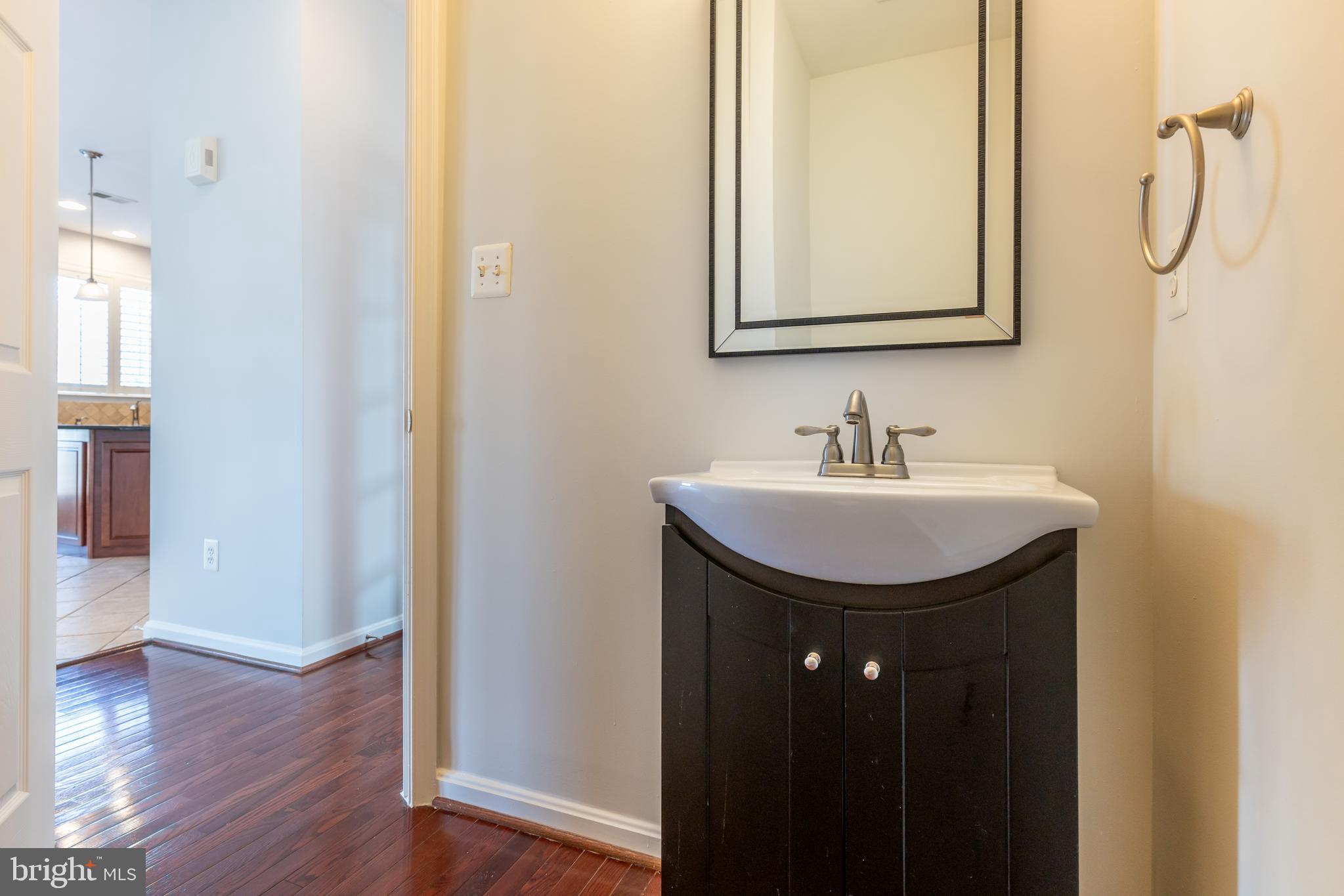 12675 Rushing Creek Court Bristow, VA 20136 - Photo 31 of 49 a bathroom with a sink vanity and a mirror