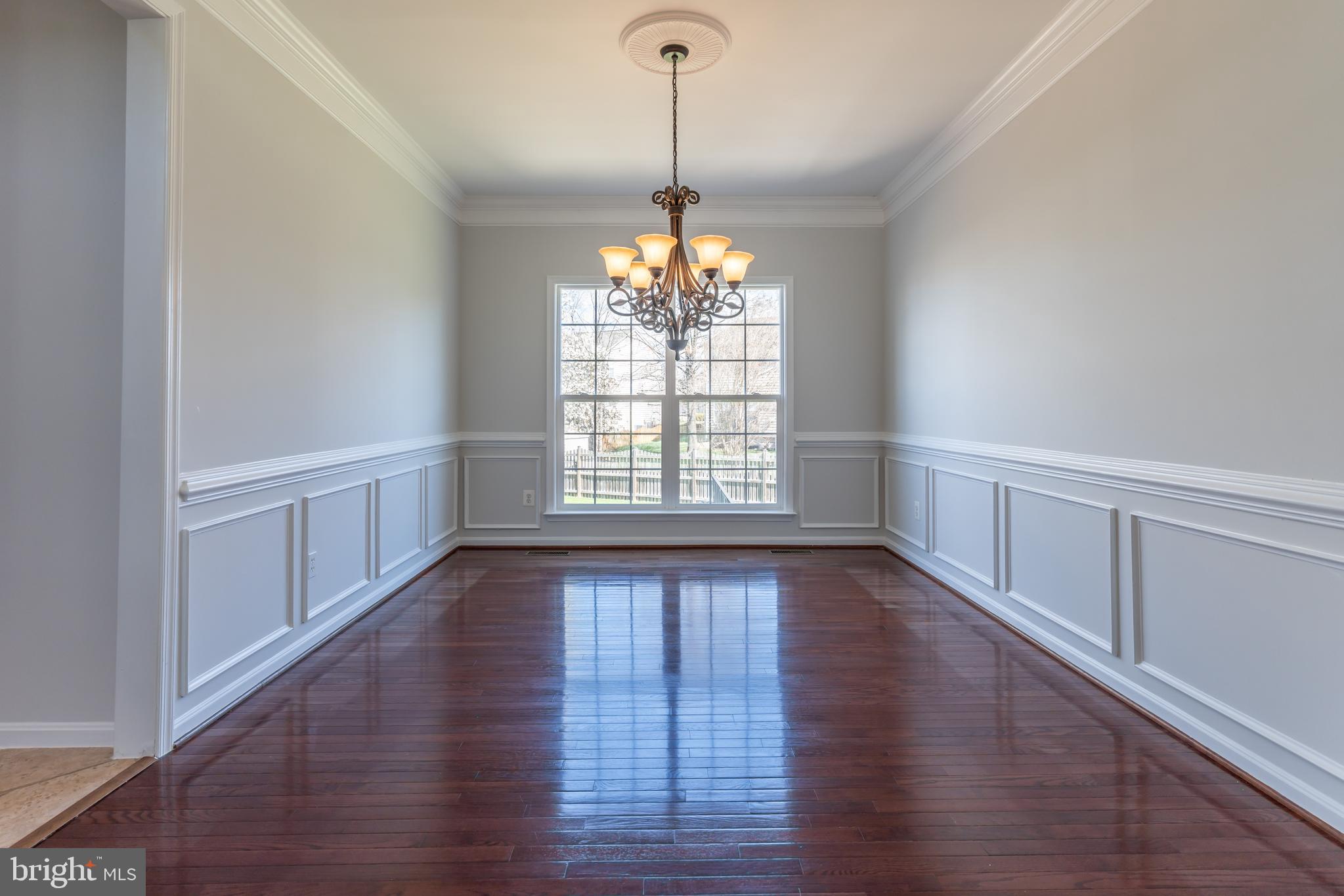12675 Rushing Creek Court Bristow, VA 20136 - Photo 37 of 49 a view of an empty room with wooden floor and a window