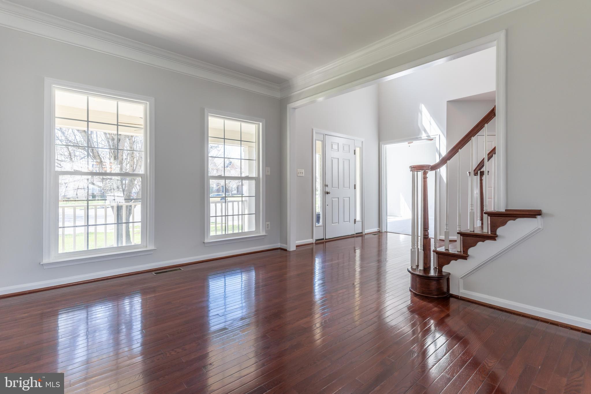 12675 Rushing Creek Court Bristow, VA 20136 - Photo 38 of 49 a view of an entryway with wooden floor and staircase