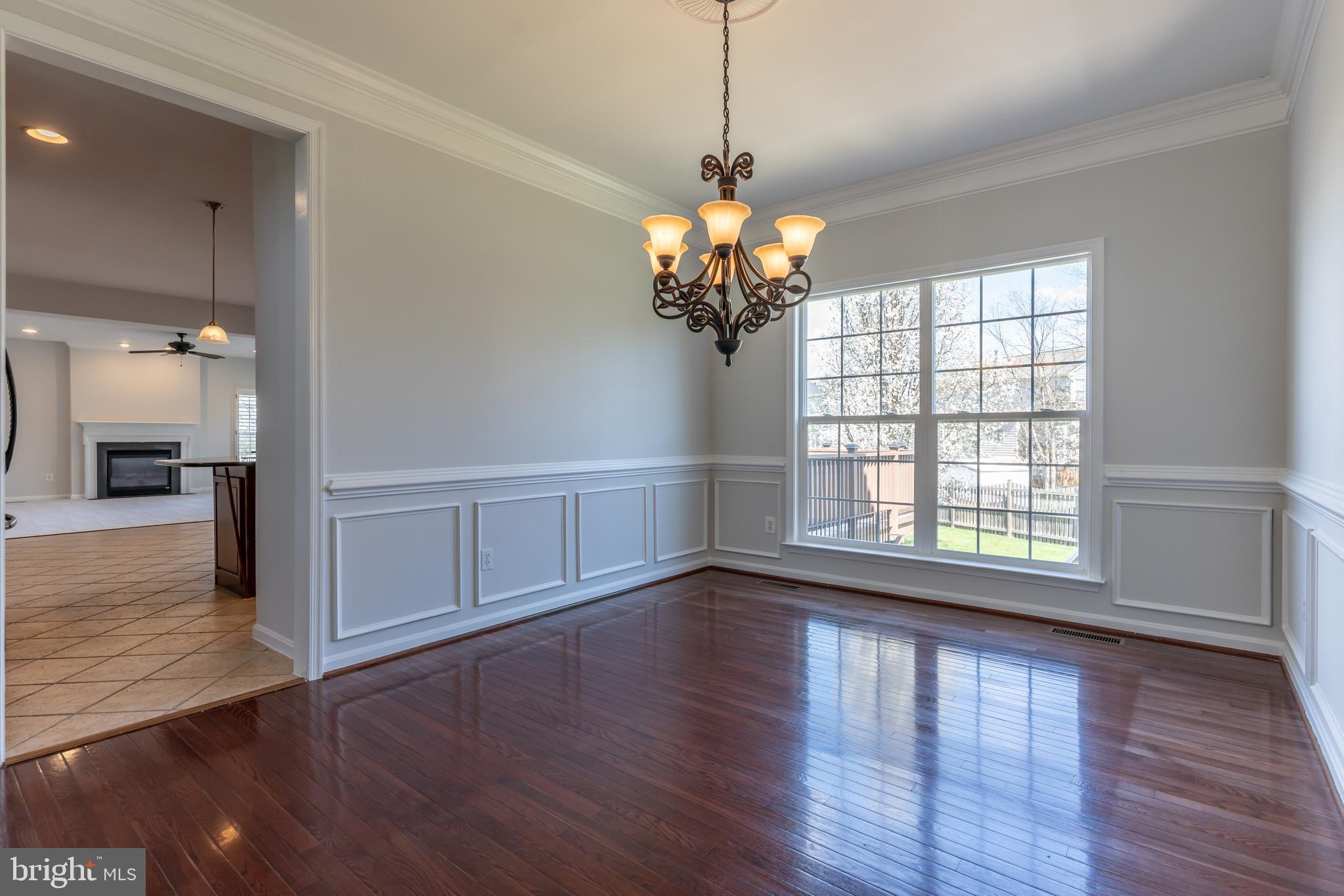 12675 Rushing Creek Court Bristow, VA 20136 - Photo 39 of 49 a view of an empty room with wooden floor and a window