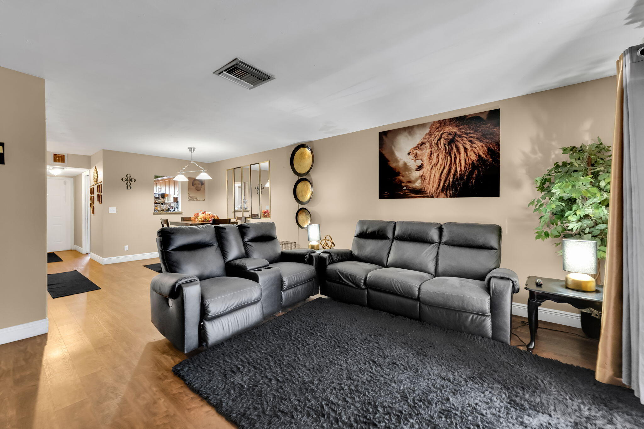 139 Sparrow Drive, Unit 2A Royal Palm Beach, FL 33411 - Photo 17 of 30 a living room with furniture and a potted plant