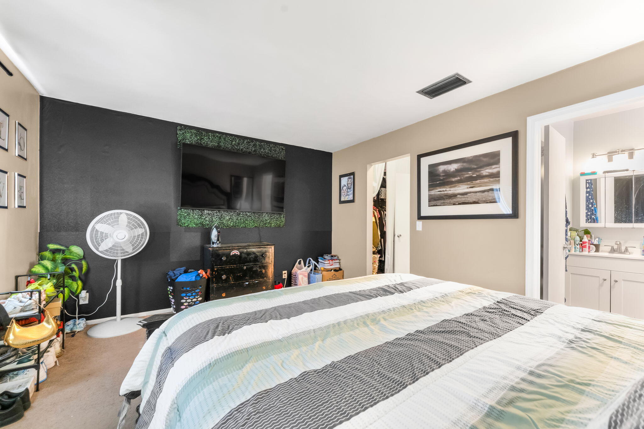 139 Sparrow Drive, Unit 2A Royal Palm Beach, FL 33411 - Photo 20 of 30 a bedroom with bed and a window