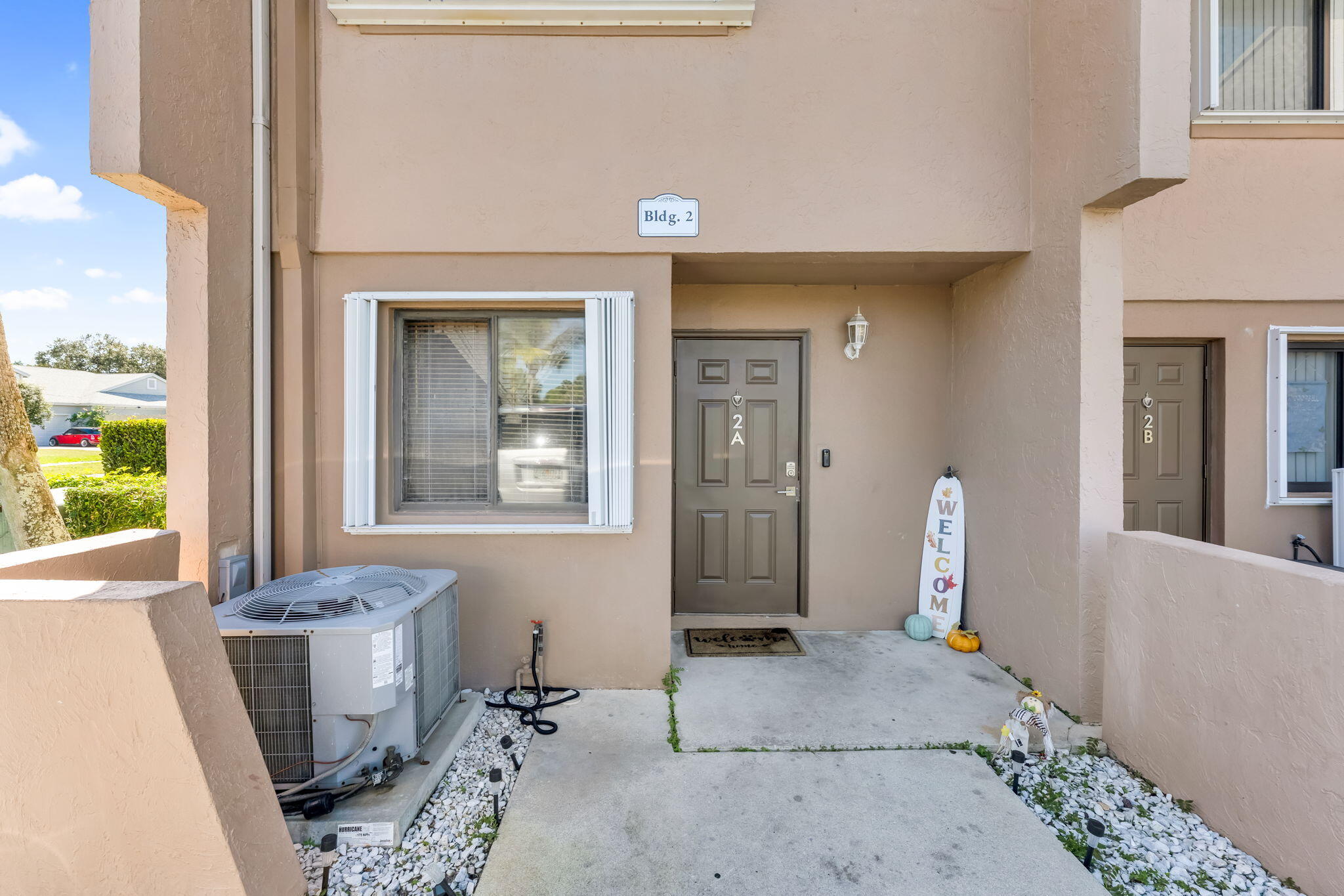 139 Sparrow Drive, Unit 2A Royal Palm Beach, FL 33411 - Photo 2 of 30 a bathroom with a sink and a mirror