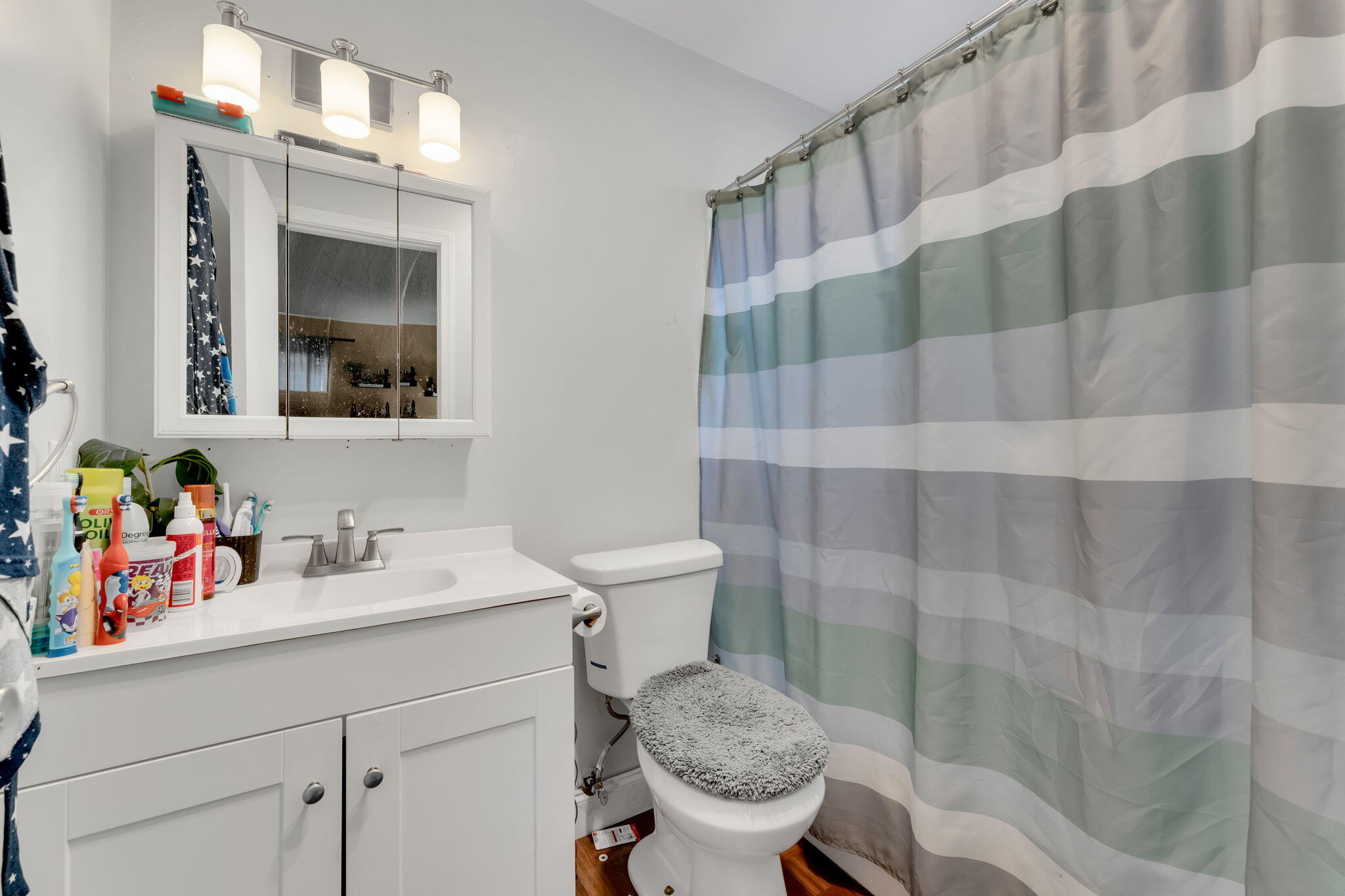 139 Sparrow Drive, Unit 2A Royal Palm Beach, FL 33411 - Photo 21 of 30 a bathroom with a sink a toilet and shower