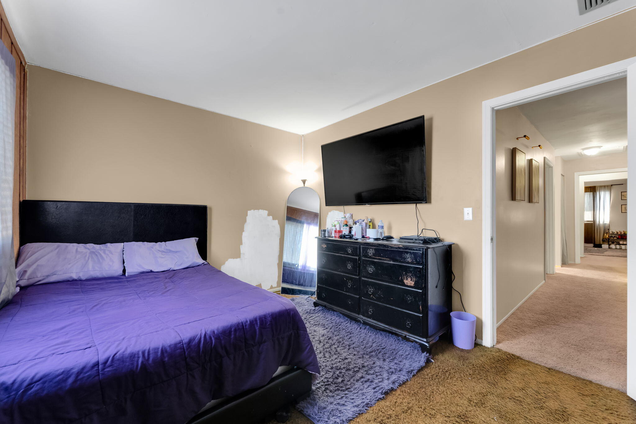 139 Sparrow Drive, Unit 2A Royal Palm Beach, FL 33411 - Photo 28 of 30 a bedroom with a bed and flat screen tv