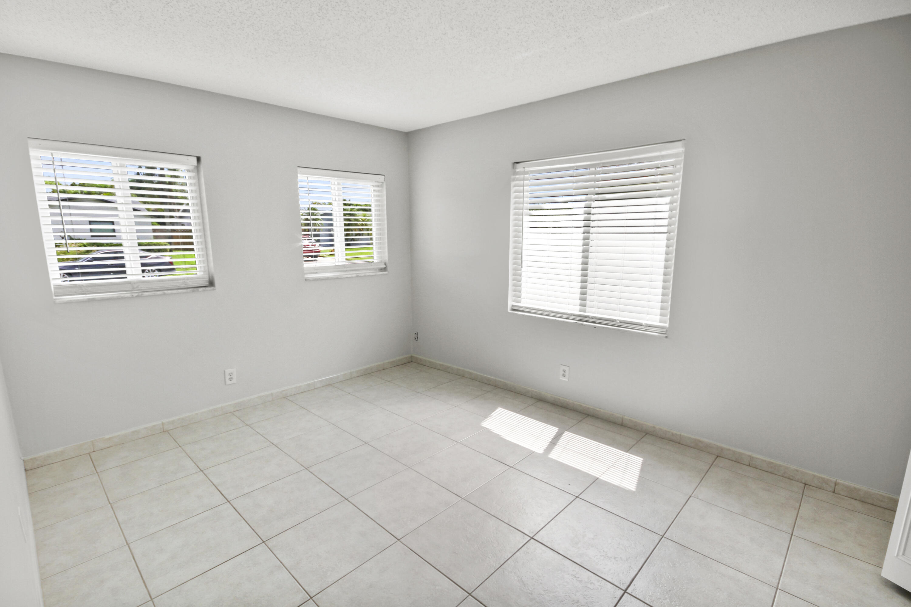 22493 Southwest 56th Avenue Boca Raton, FL 33433 - Photo 11 of 31 a view of an empty room with a window