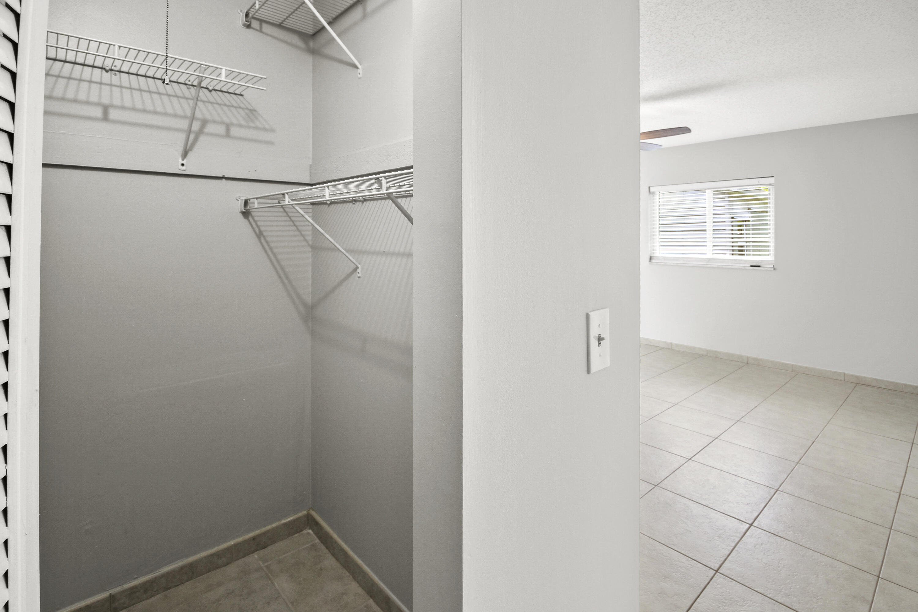 22493 Southwest 56th Avenue Boca Raton, FL 33433 - Photo 12 of 31 a view of a room with racks on the wall