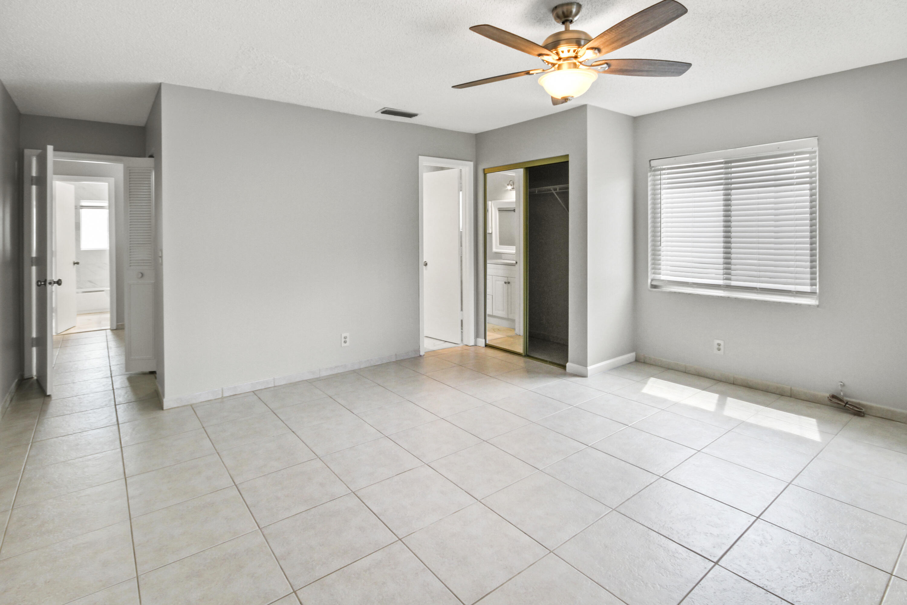 22493 Southwest 56th Avenue Boca Raton, FL 33433 - Photo 14 of 31 a view of an empty room with a window