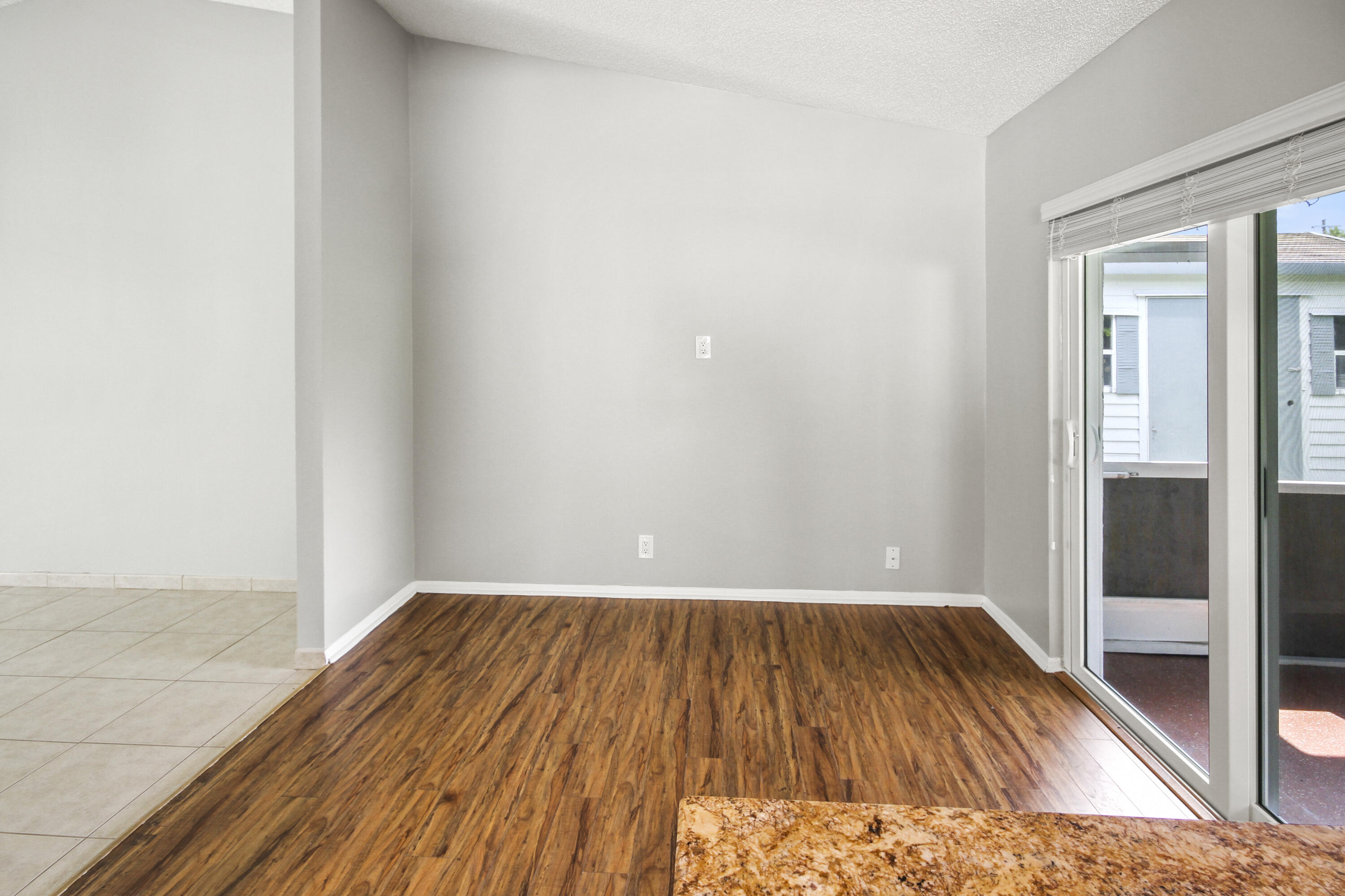 22493 Southwest 56th Avenue Boca Raton, FL 33433 - Photo 17 of 31 a view of a room with wooden floor and a bathroom