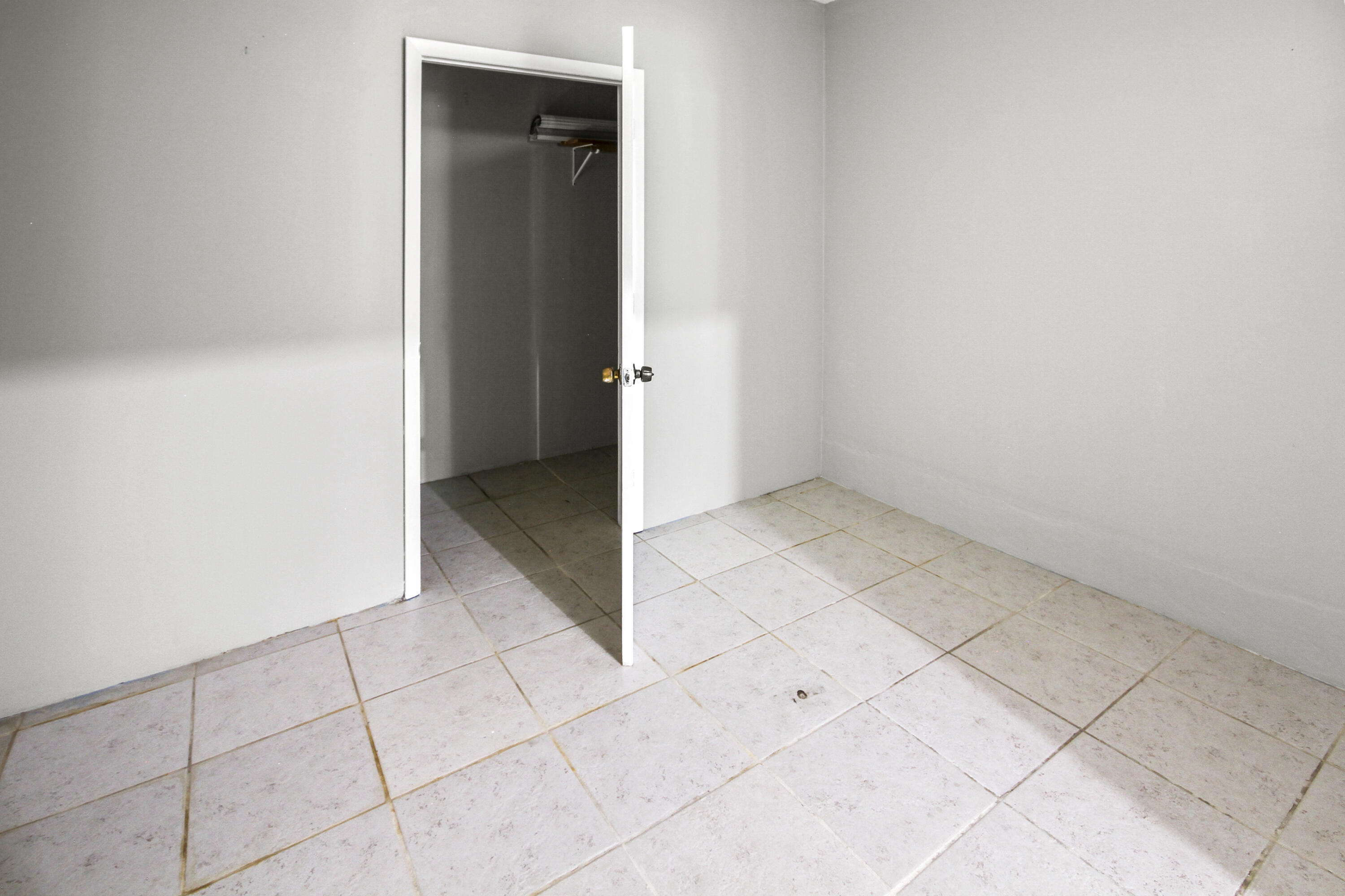 22493 Southwest 56th Avenue Boca Raton, FL 33433 - Photo 25 of 31 an empty room with cabinet