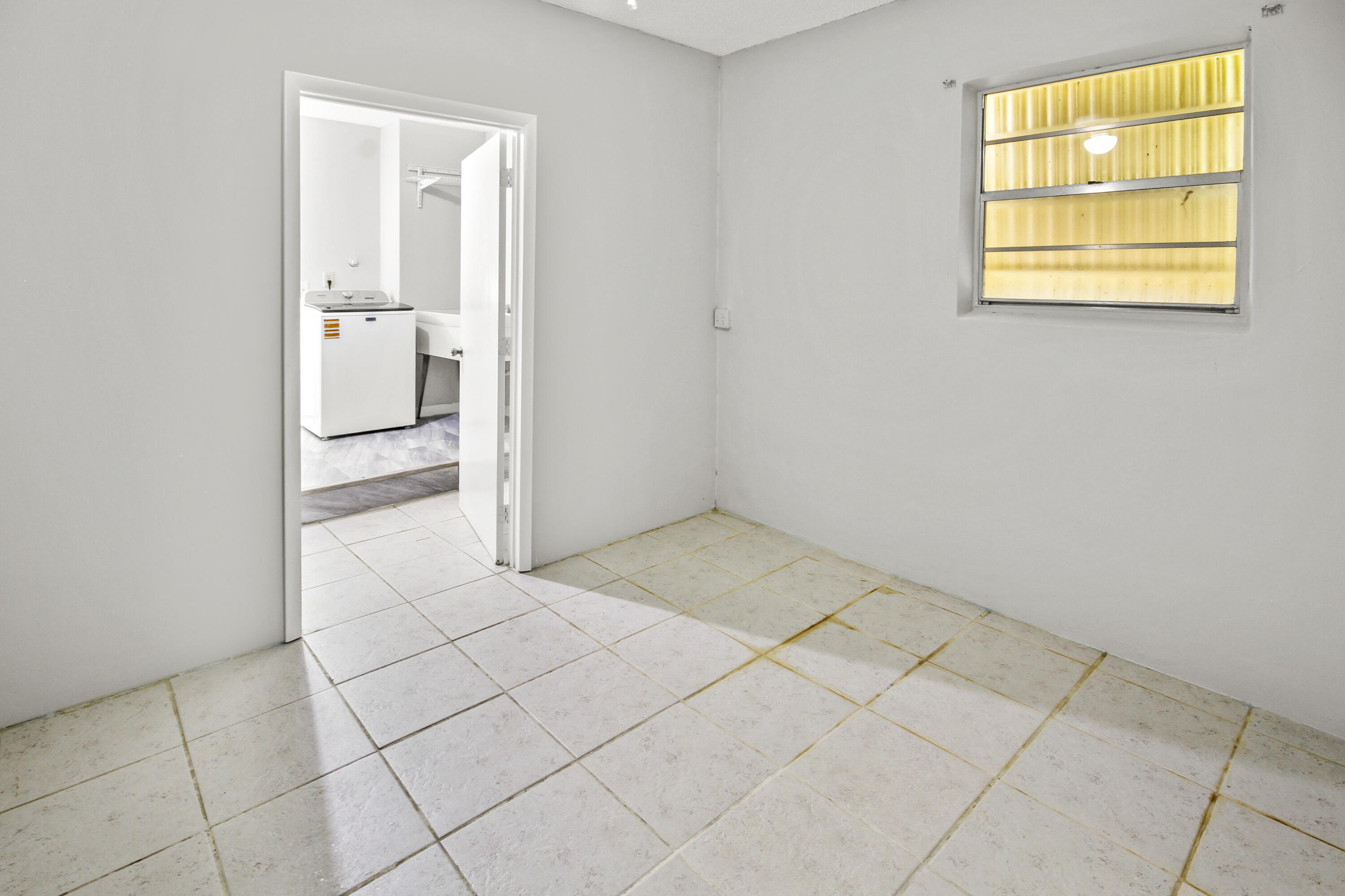 22493 Southwest 56th Avenue Boca Raton, FL 33433 - Photo 26 of 31 a view of a storage & utility room in a house