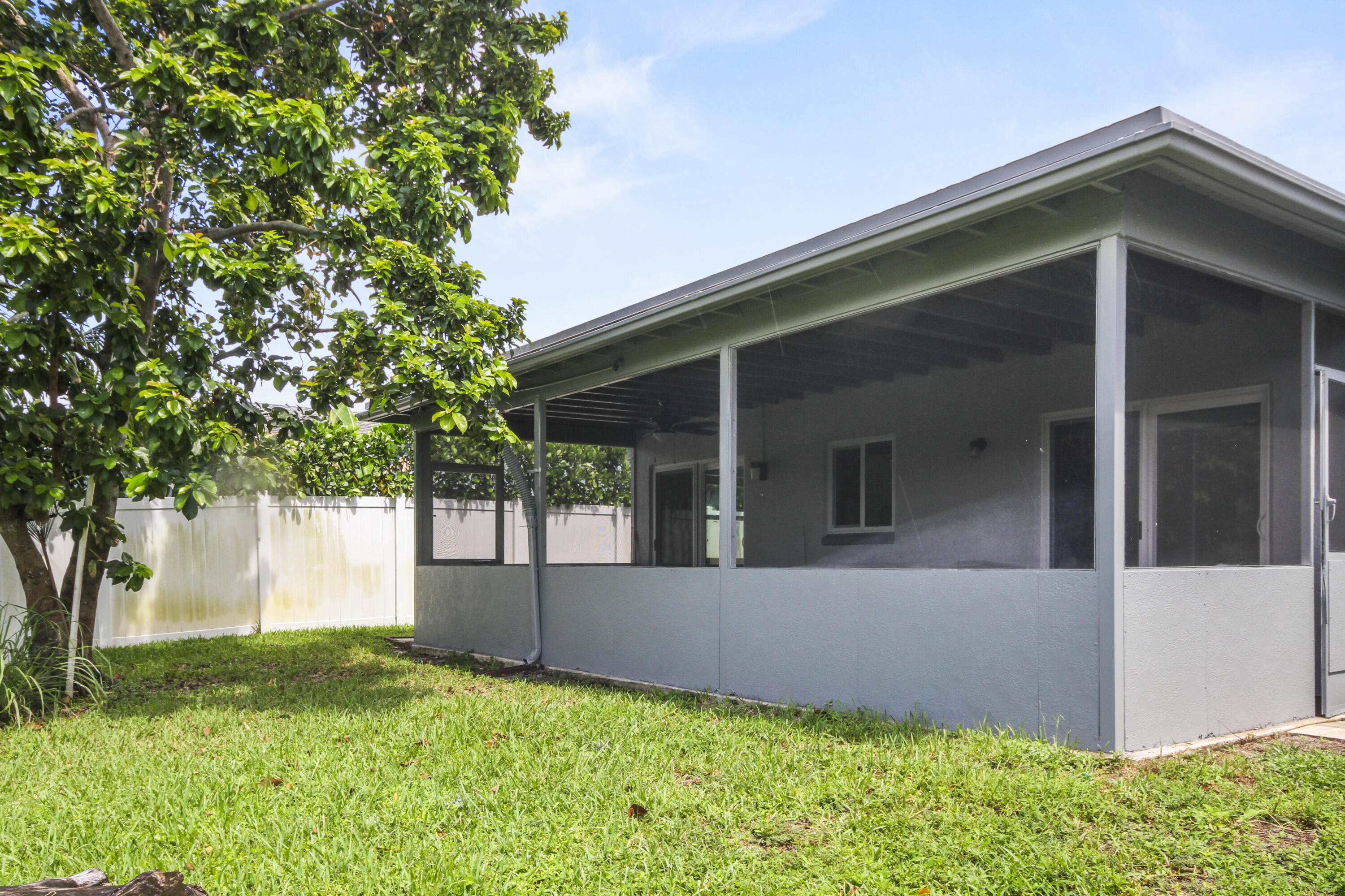 22493 Southwest 56th Avenue Boca Raton, FL 33433 - Photo 29 of 31 a view of a house with a yard