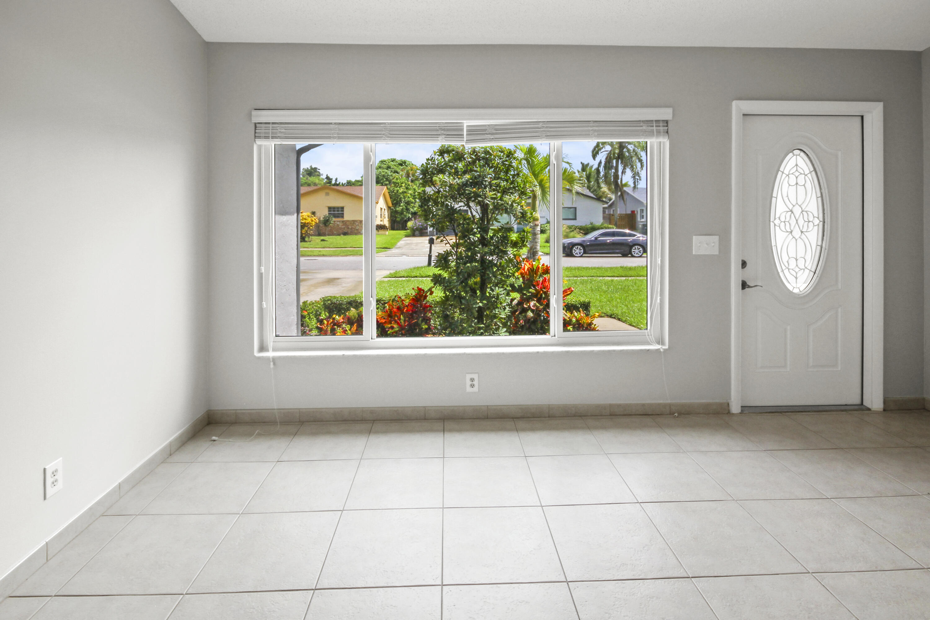 22493 Southwest 56th Avenue Boca Raton, FL 33433 - Photo 3 of 31 an empty room with window