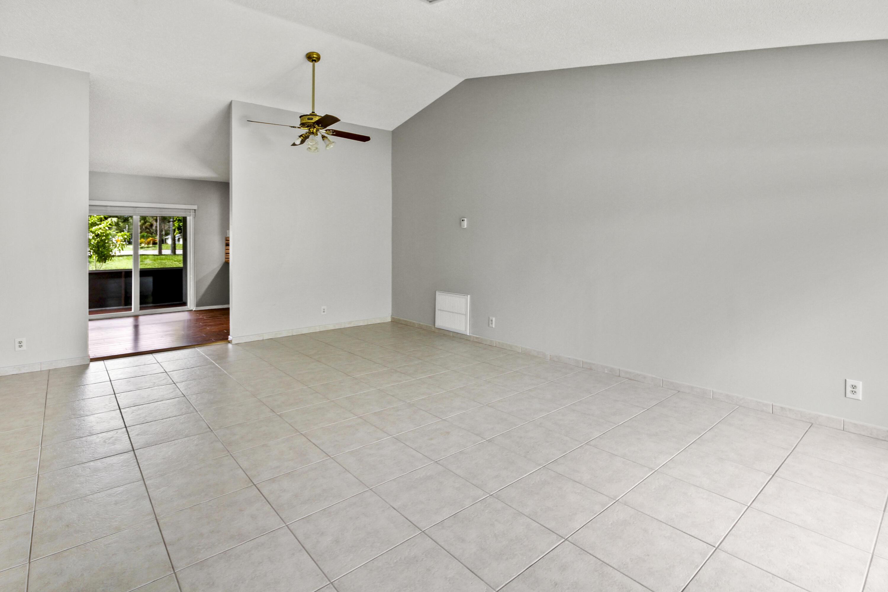 22493 Southwest 56th Avenue Boca Raton, FL 33433 - Photo 6 of 31 an empty room with windows