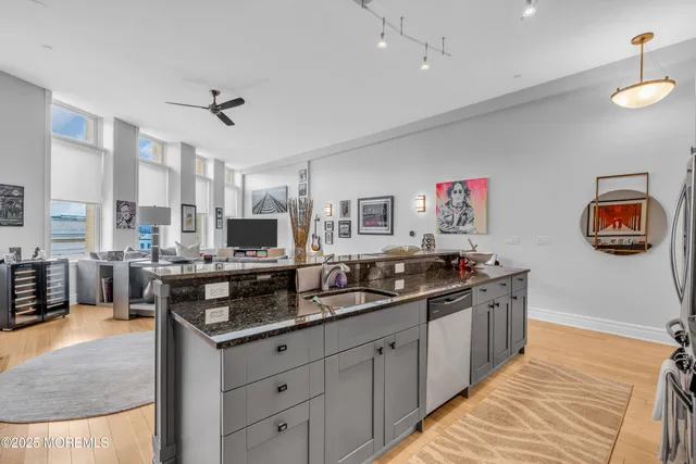 a kitchen with stainless steel appliances granite countertop a stove and a sink