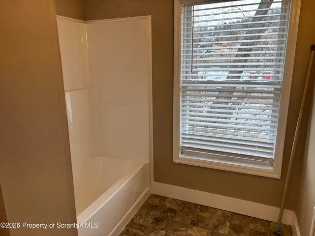 a bathroom with a bathtub