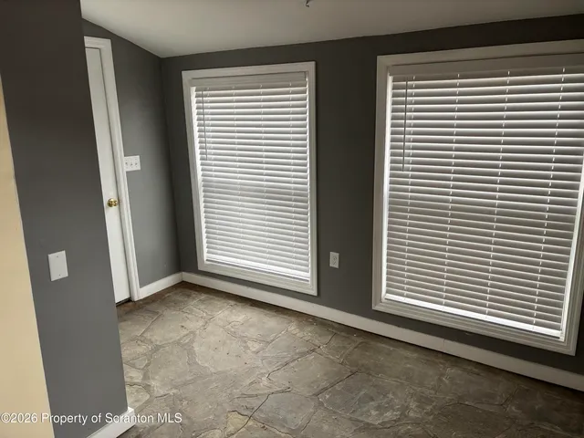 a view of a room that has a window in it