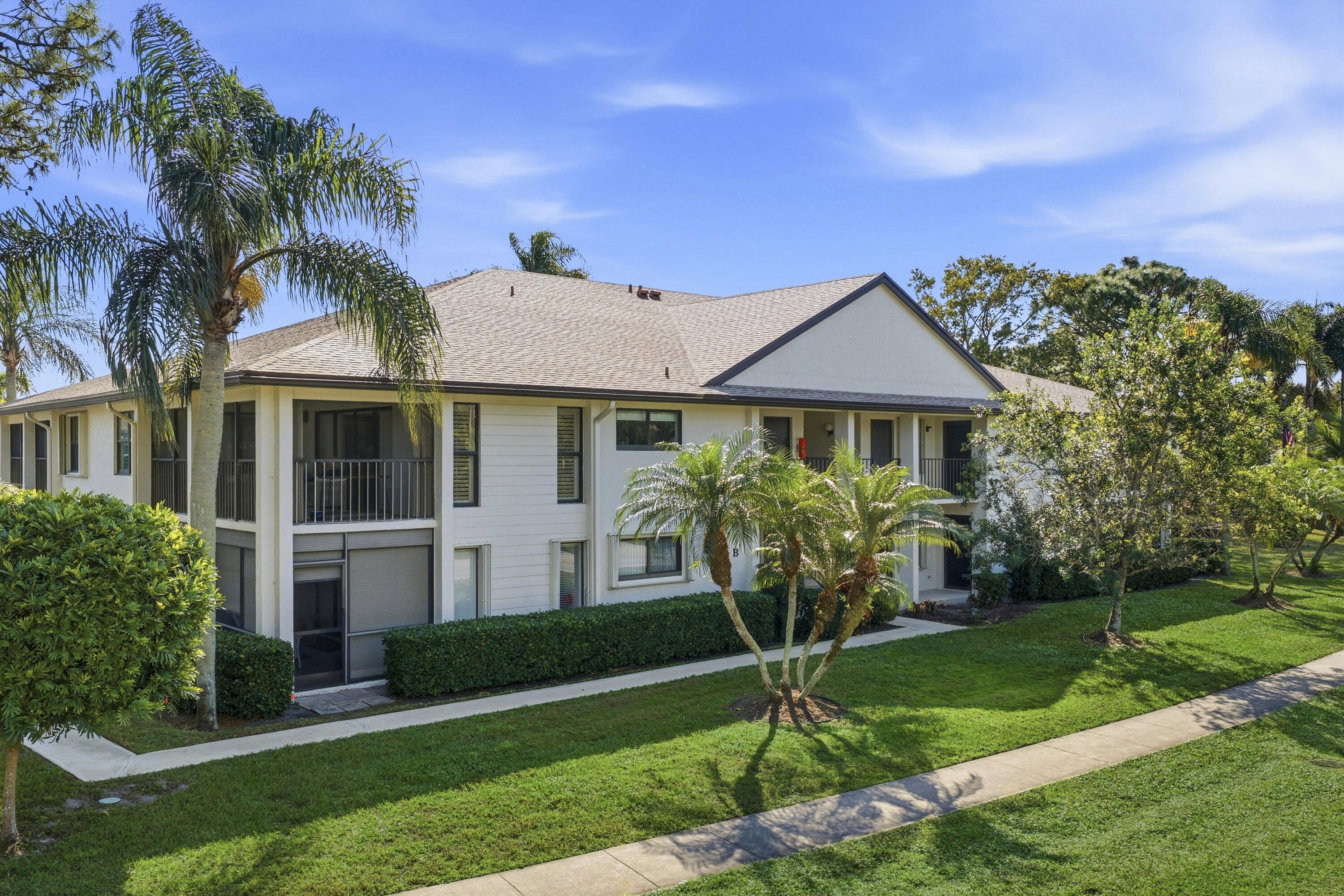 802 Wingfoot Drive, Unit B Jupiter, FL 33458 - Photo 26 of 30 DJI_20260124133225_0135_D_with_grass