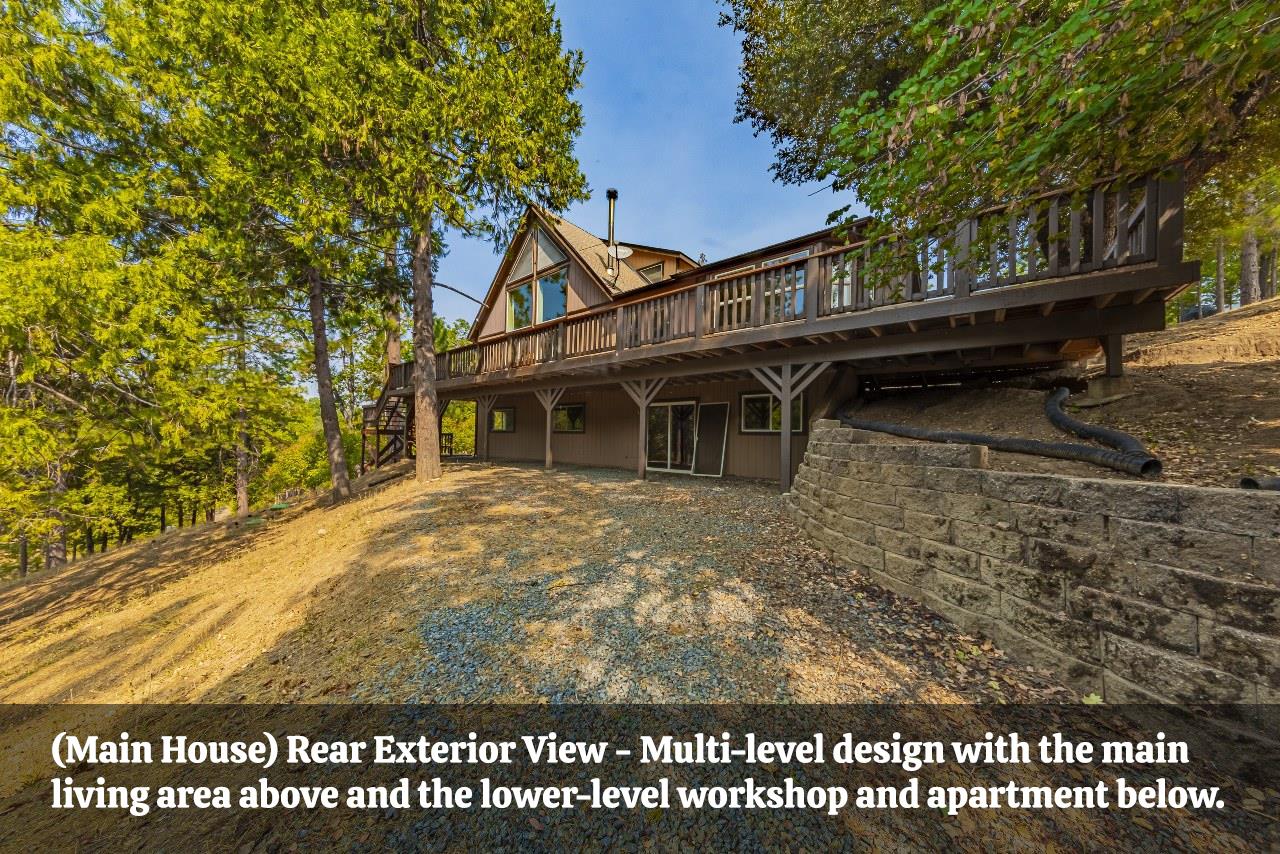 a view of a house with a large window and large tree