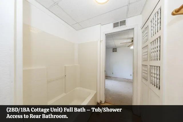 a bathroom with a sink a mirror and next to a window