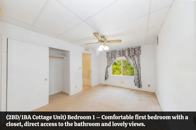 a view of a hallway with wooden floor and a cabinet