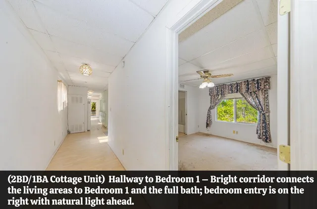 a view of a living room and a floor to ceiling window