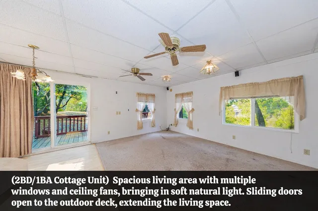 a view of a kitchen with kitchen island a sink and a window