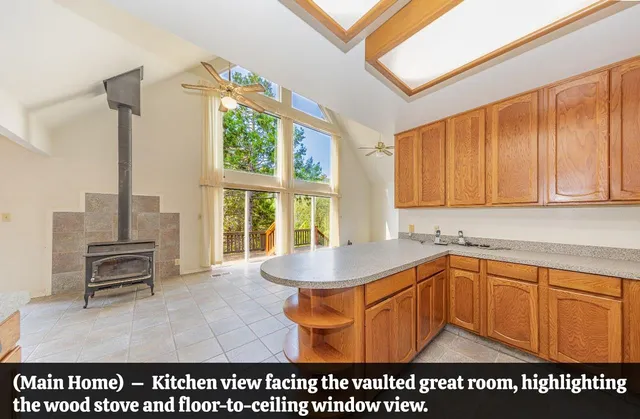 a kitchen with stainless steel appliances granite countertop a refrigerator and a stove top oven