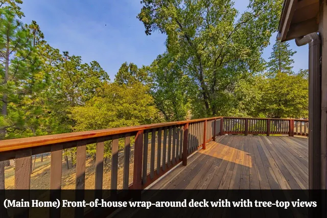 a view of balcony with wooden floor and fence