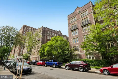 a view of a chair and tables in the patio