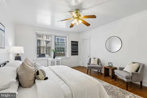 a bedroom with bed and a window