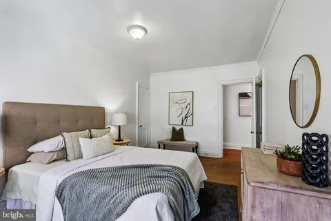 a bedroom with bed and a dresser